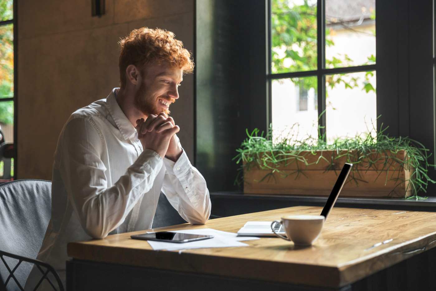 Professional working confidently at a computer